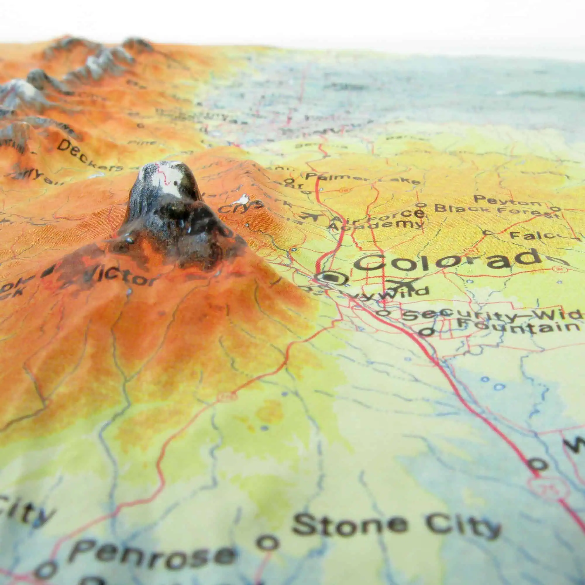 Colorful topographical map of Colorado featuring mountain ranges, cities, and routes shown in vibrant detail. A 3D map highlighting Colorado's terrain and geography for navigation and travel planning.