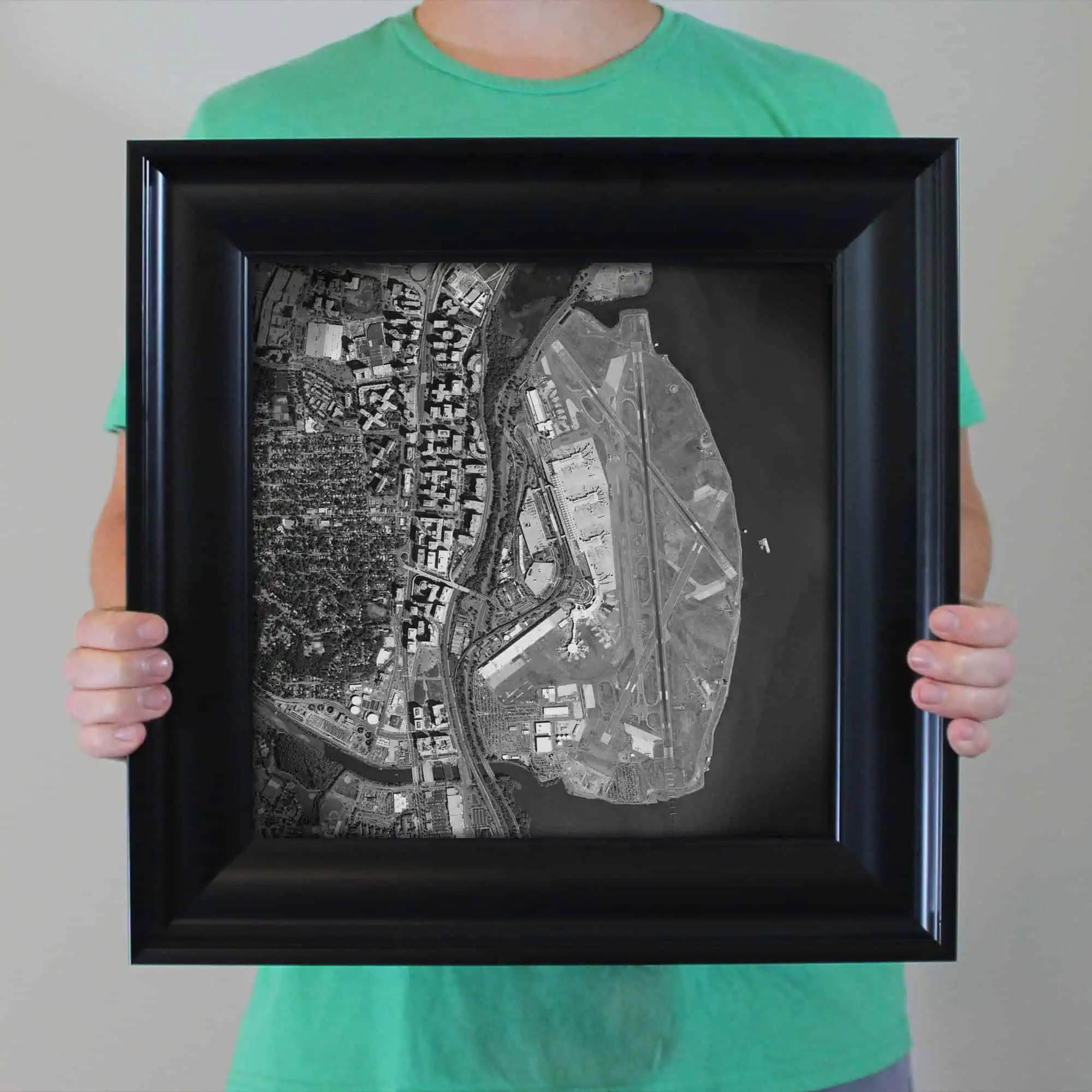 Detailed aerial map of a city with roads, buildings, and waterways, highlighting urban planning and geographic features.