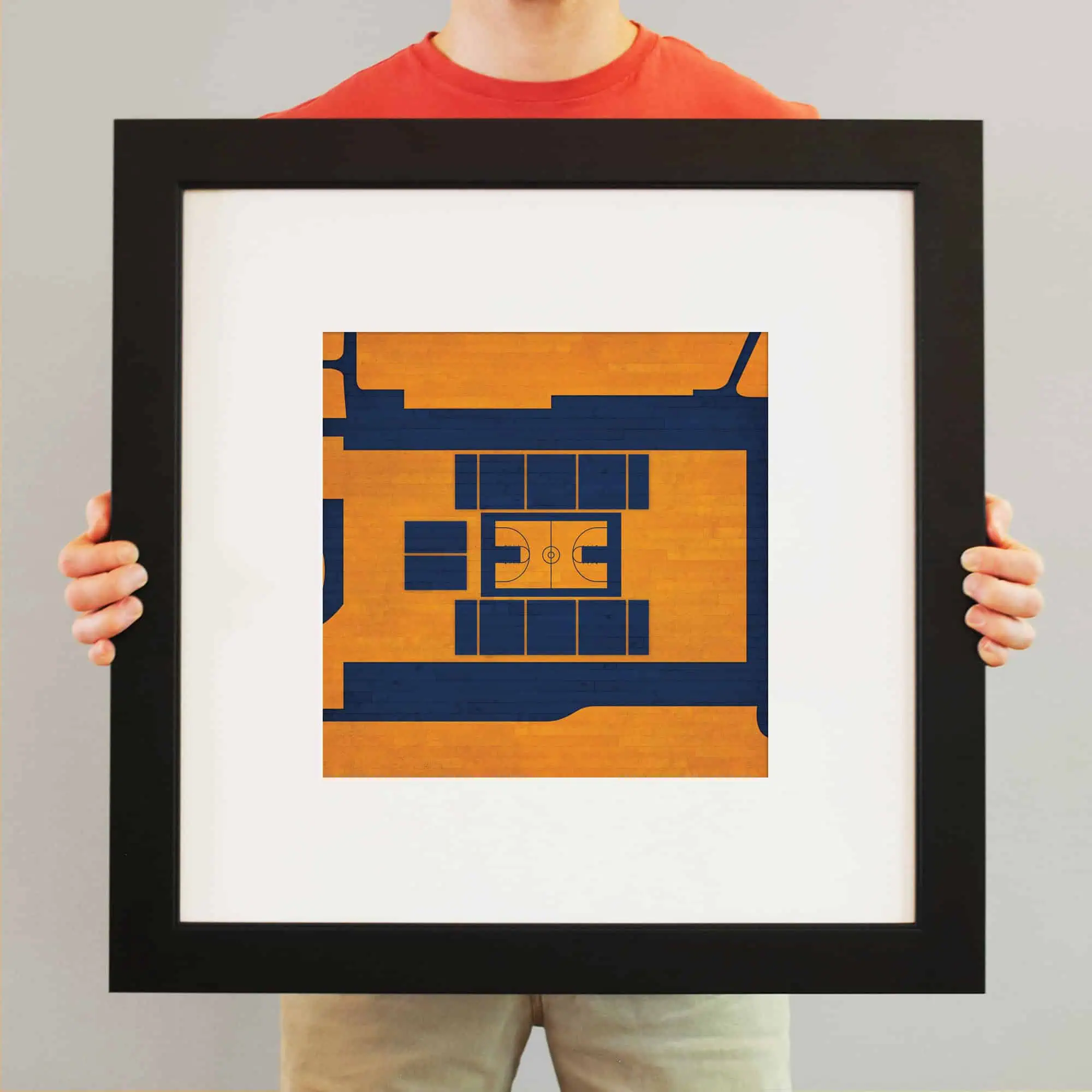 A framed aerial view of a basketball court with a wooden floor and blue boundary lines, perfect for sports and court enthusiasts.