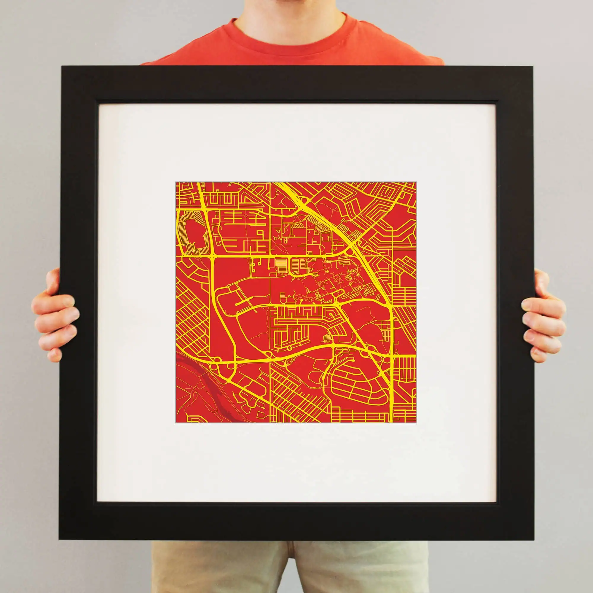 Vivid city street map print in red and yellow, framed for wall decor, perfect for urban navigation enthusiasts and map collectors.