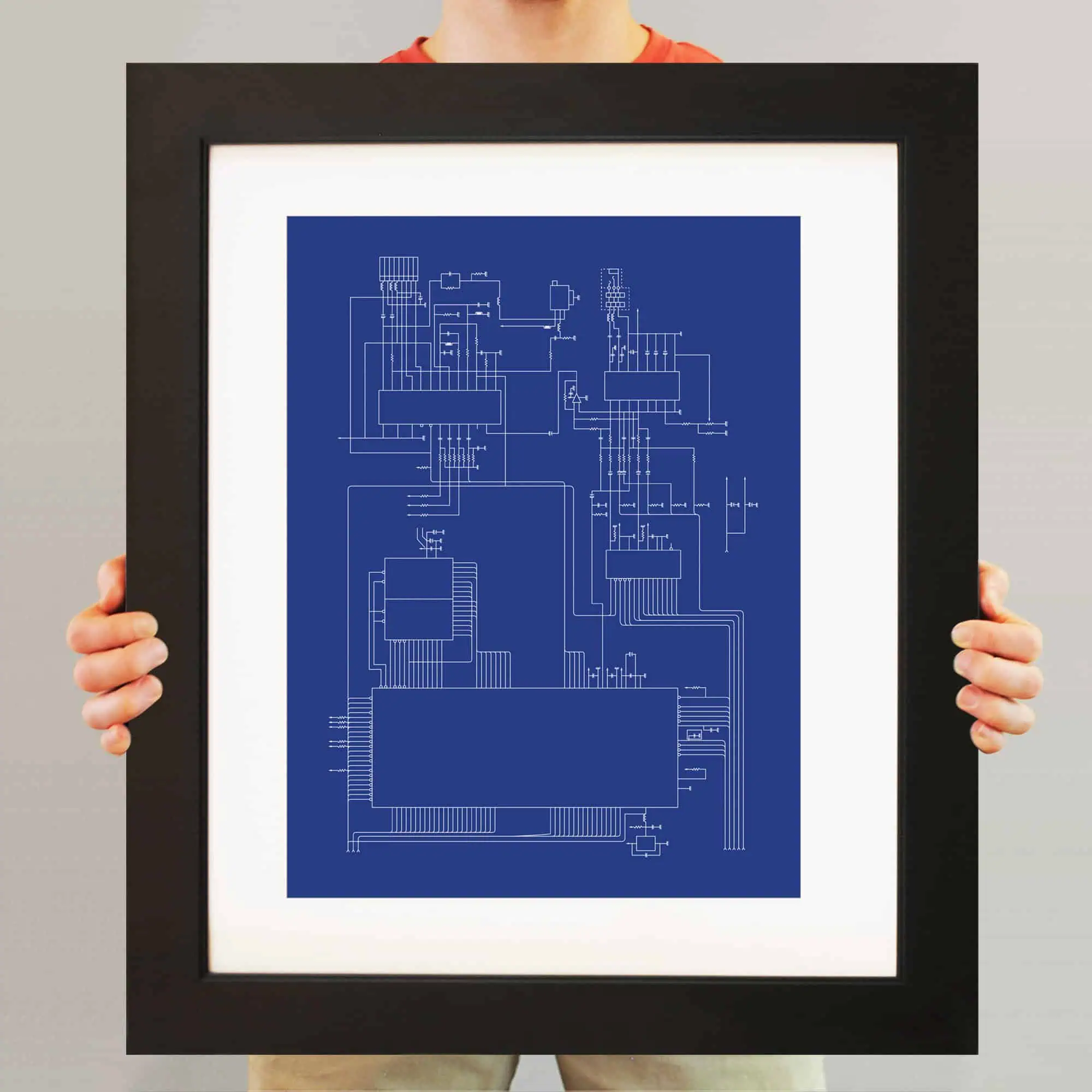 Blueprint architecture drawing framed art behind glass for interior decor.