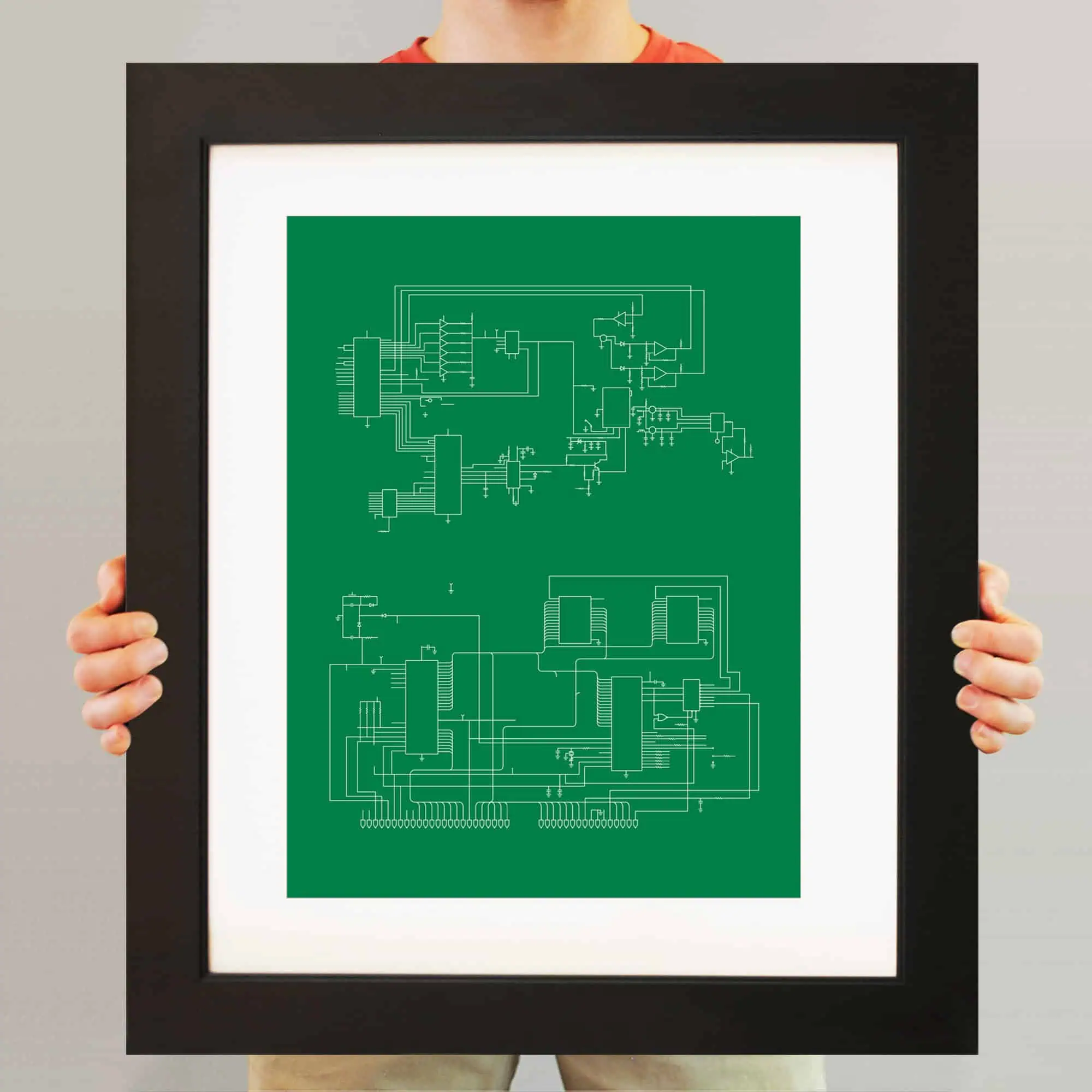 High-resolution image of a framed technical schematic diagram on a green background, showcasing detailed electronic circuit designs, ideal for electronics enthusiasts and engineers.
