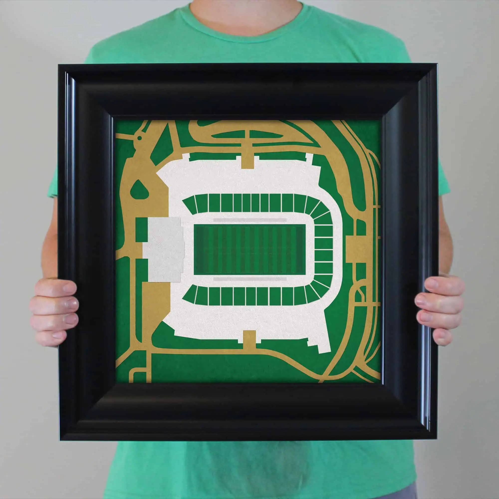 A framed map of a sports stadium showing seating and surrounding streets, ideal for sports venue navigation and event planning.