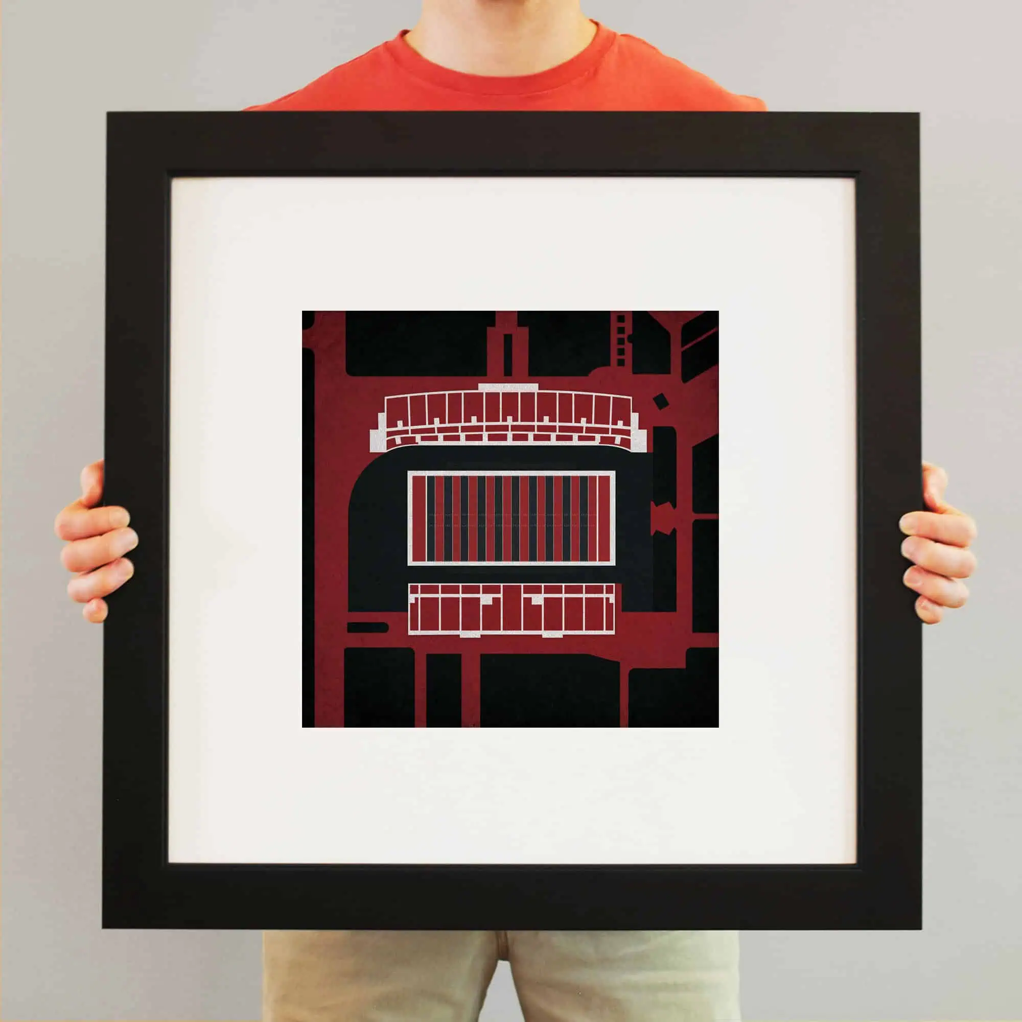 Colorful abstract map artwork depicting city streets and landmarks, framed for wall display.