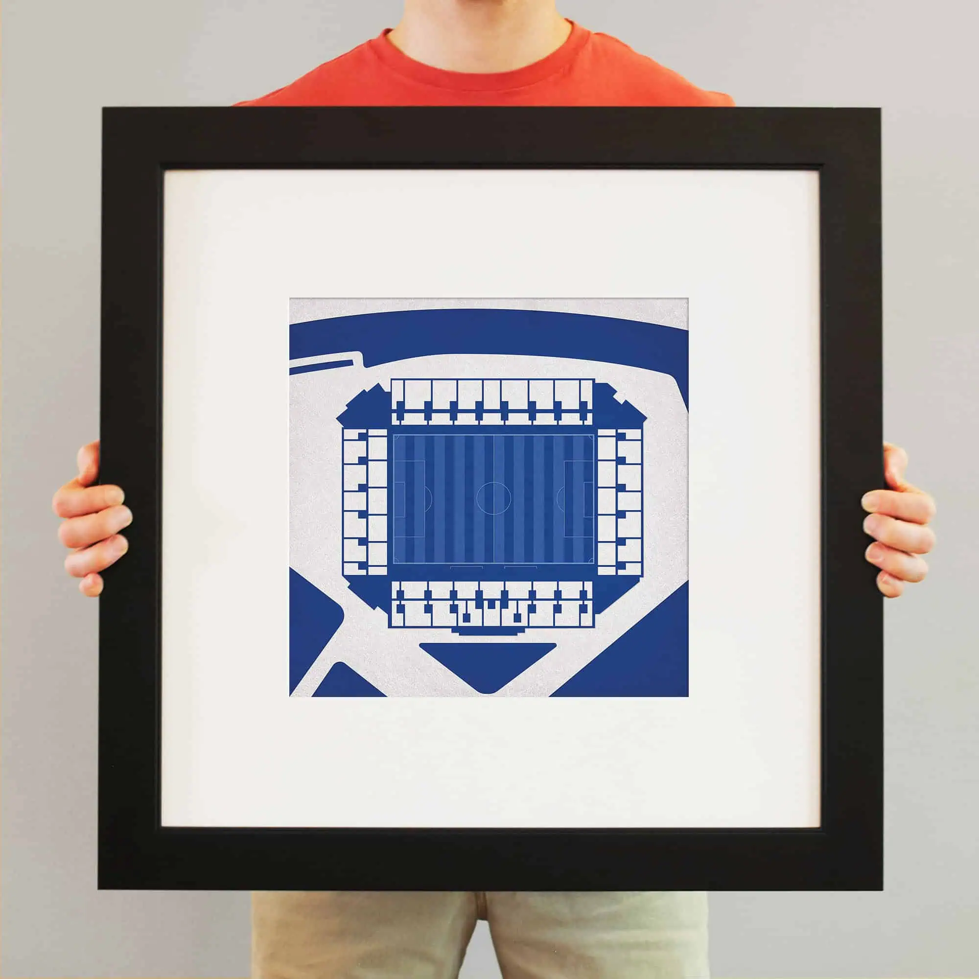 Blue and white architectural drawing of a sports stadium, framed for display or sale.