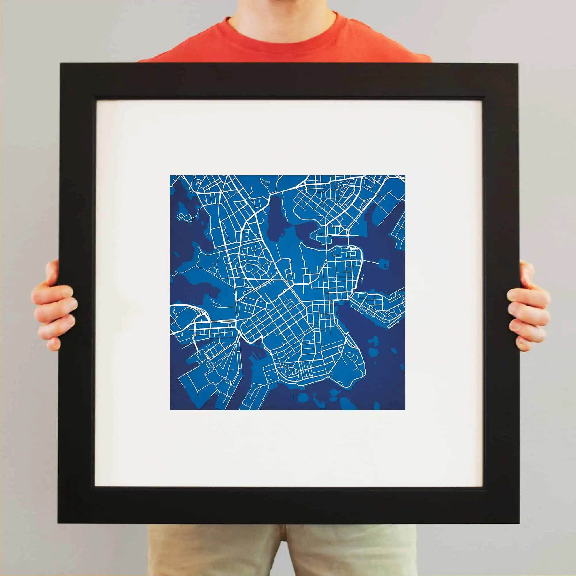 Vibrant blue city map artwork framed for wall display, showcasing detailed street layouts and waterways, perfect for urban art collectors and map enthusiasts.