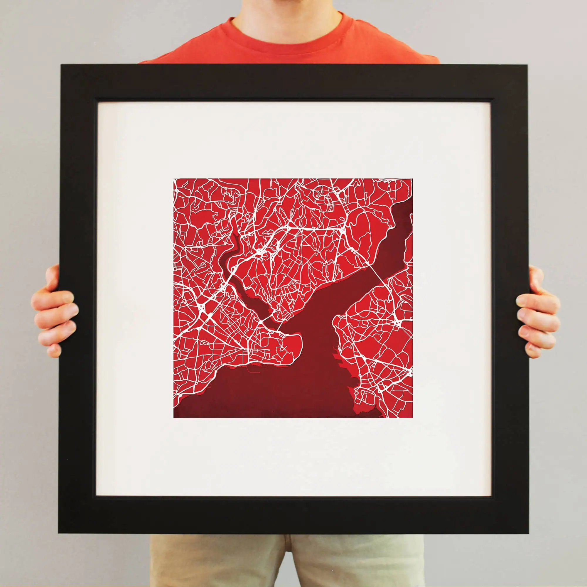 Detailed map artwork featuring a red background and white street lines, showcased in a black frame, perfect for map enthusiasts and home decor.