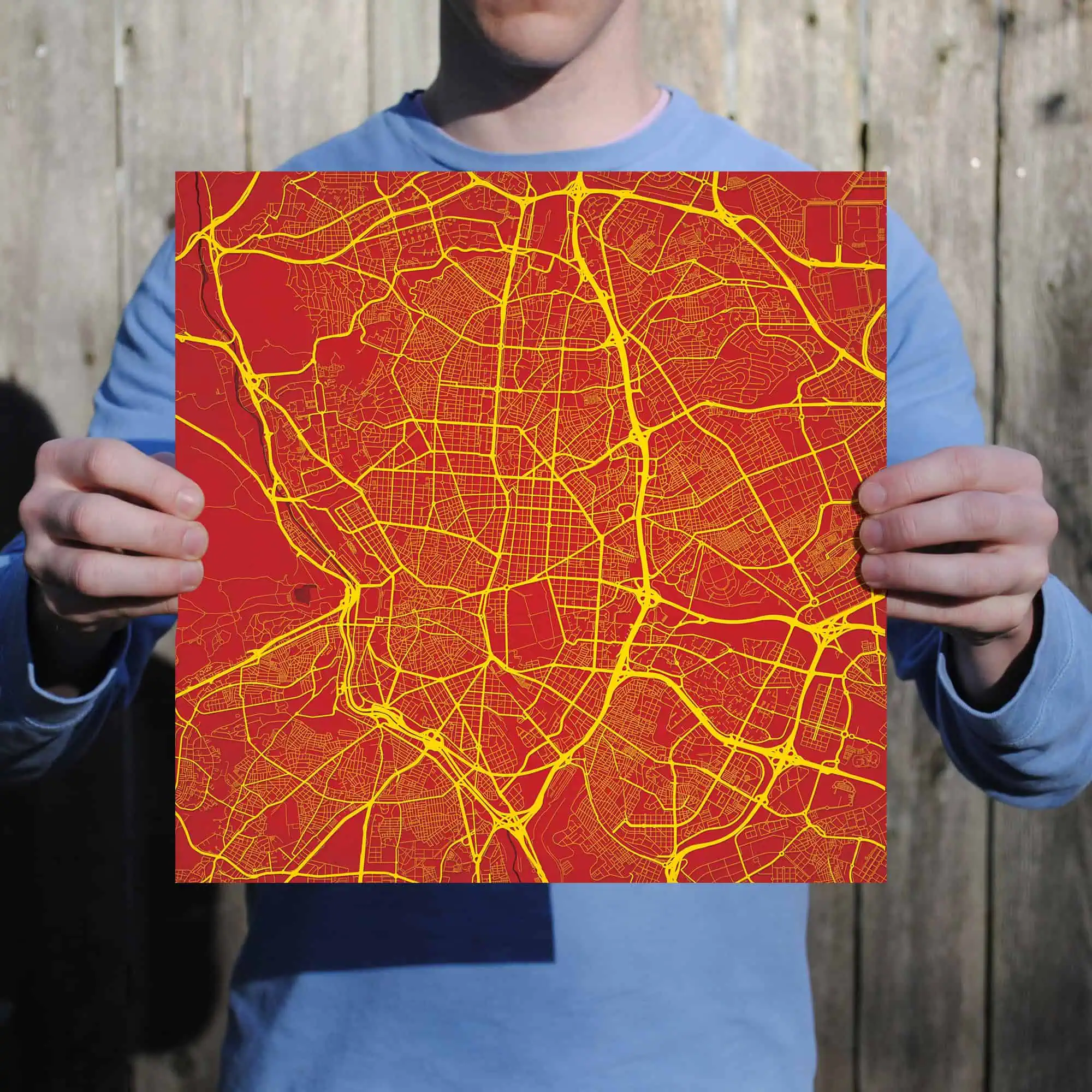A detailed city map with bright yellow streets on a bold red background, showcasing urban navigation and geographic layout for travelers and map enthusiasts.
