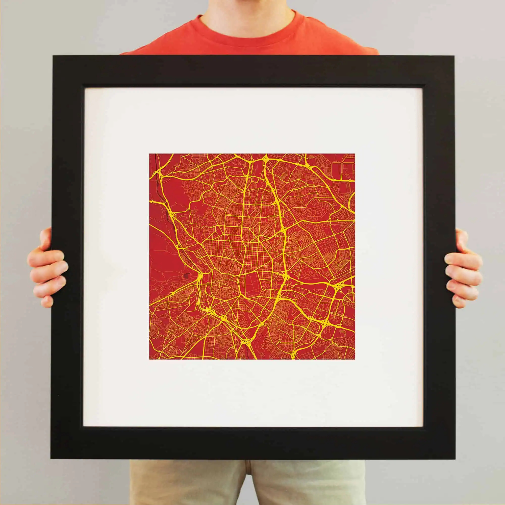 Colorful city street map art print showcasing detailed urban road layouts in vibrant red and yellow tones, ideal for home or office decor.