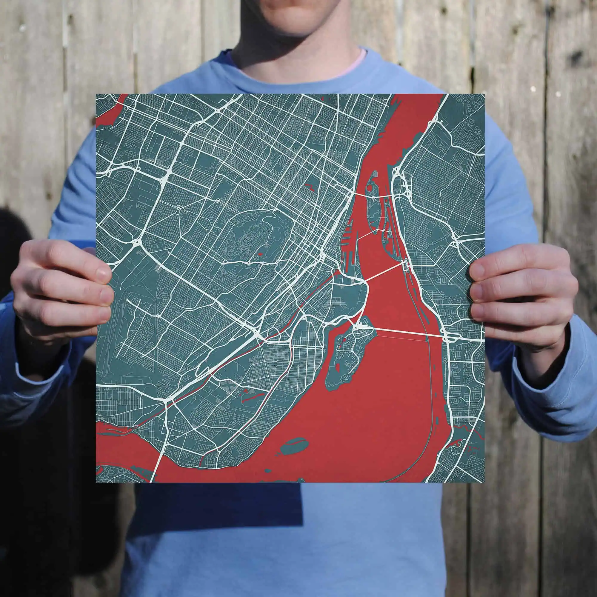 Map of city streets and waterways held by person, digital map for navigation or geographic reference, city map with detailed road and river layouts, ideal for travelers and navigation enthusiasts.
