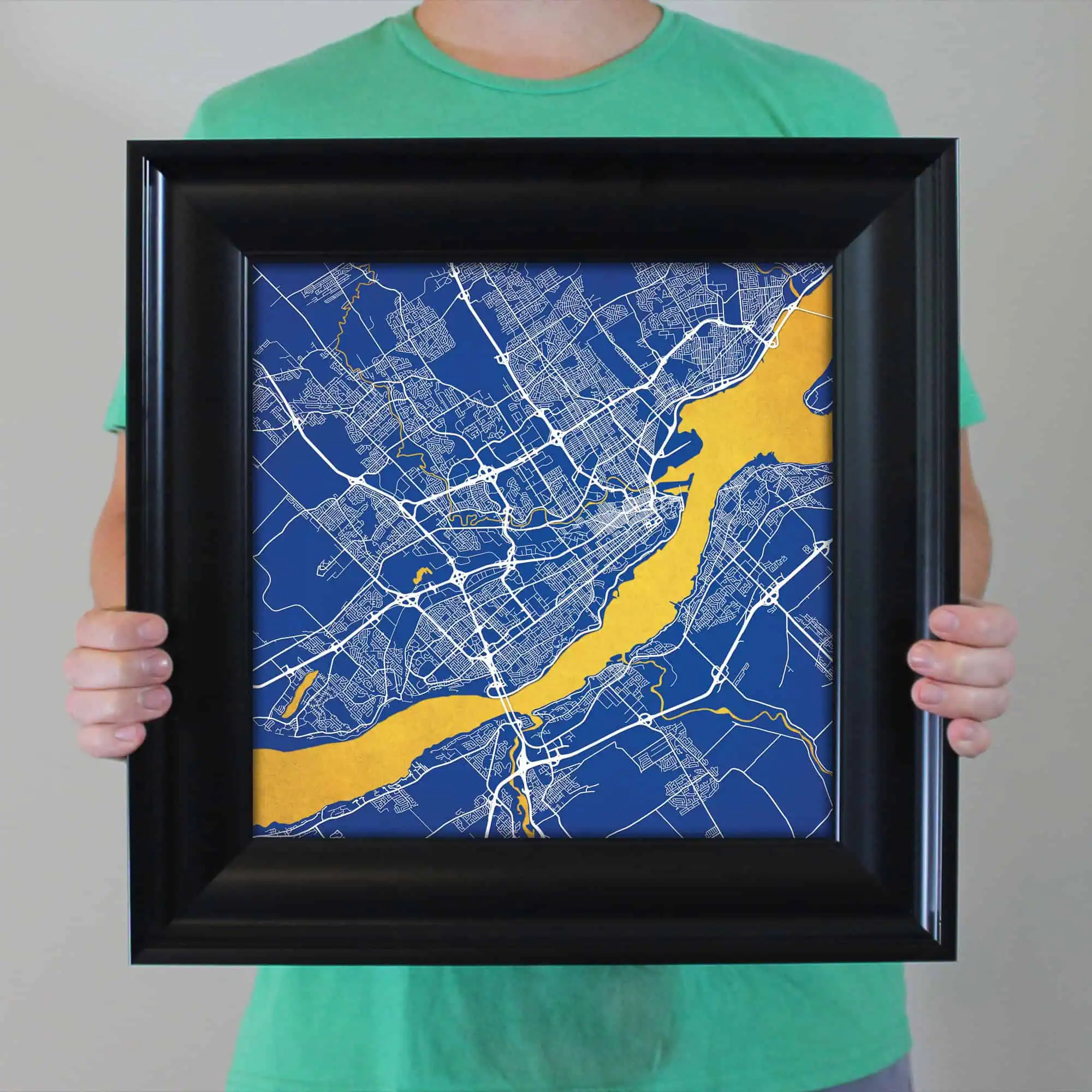 Detailed city map artwork with blue background and yellow river, perfect for travel and geography enthusiasts, framed for wall display.