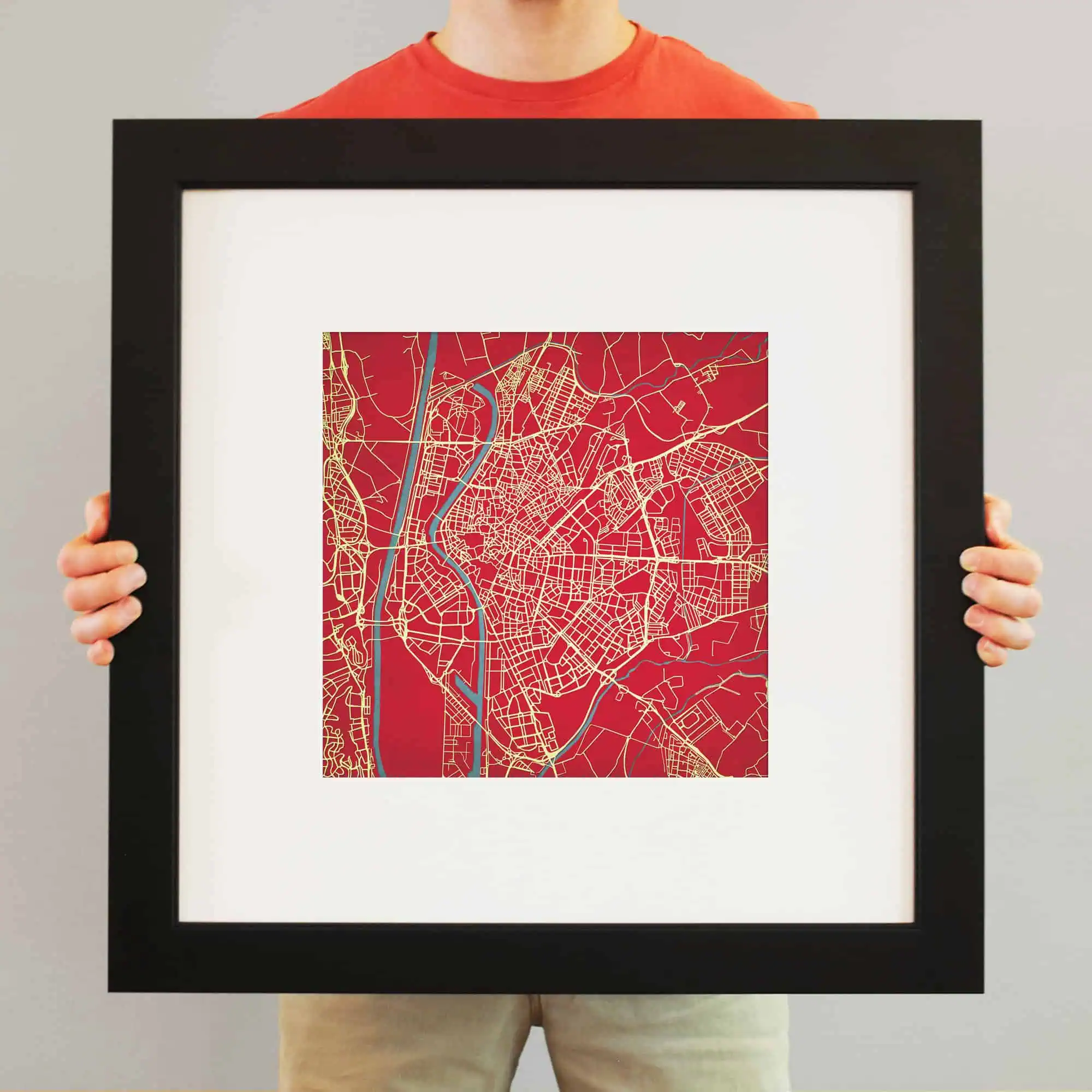 Colorful city map art print on red background, perfect for home or office decor, featuring detailed street layouts and waterways. Unique map artwork from The Map Shop.