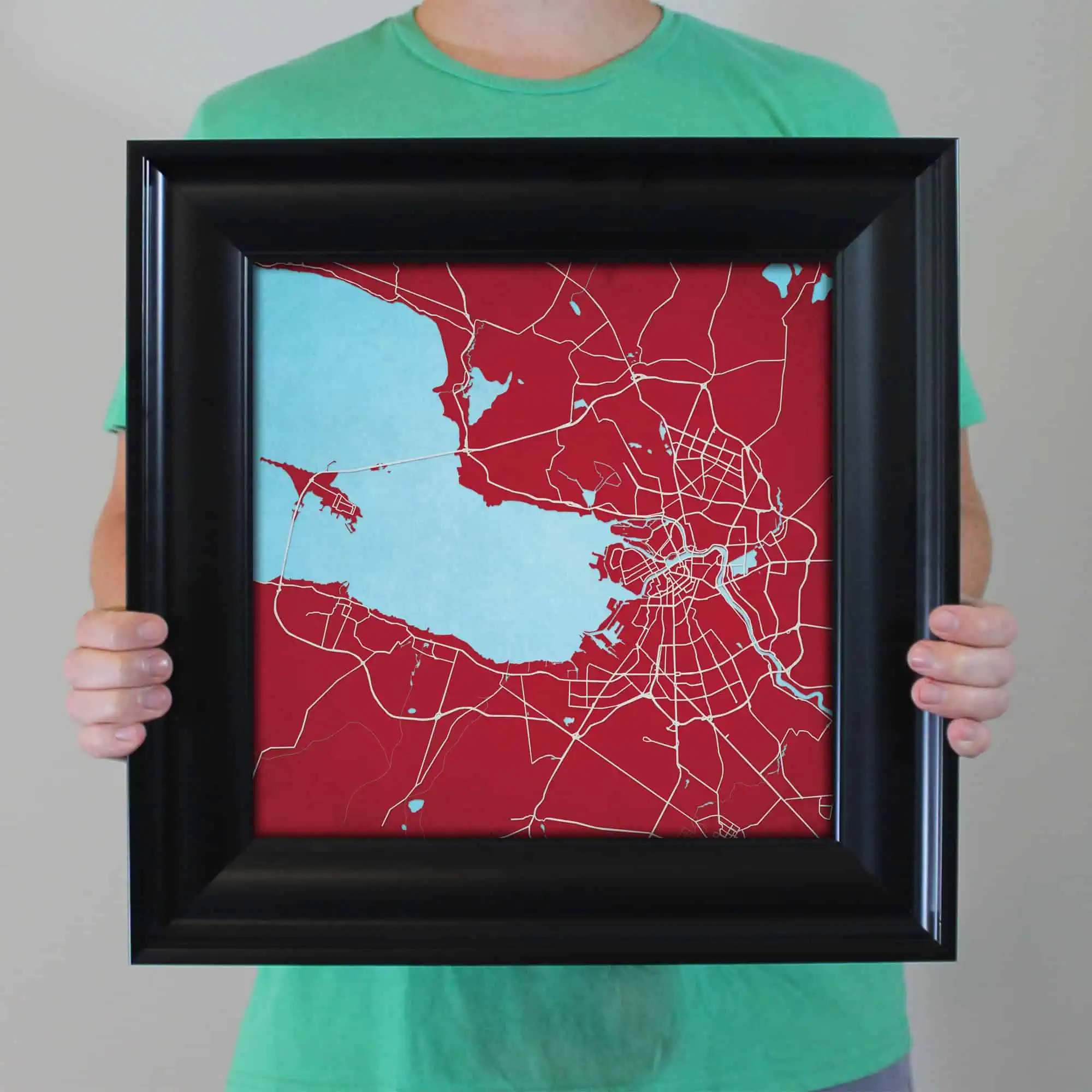 A framed map of a city and lake, emphasizing urban streets and waterways, ideal for travel planning, navigation, and geographic visualization. Perfect for map enthusiasts and travelers.