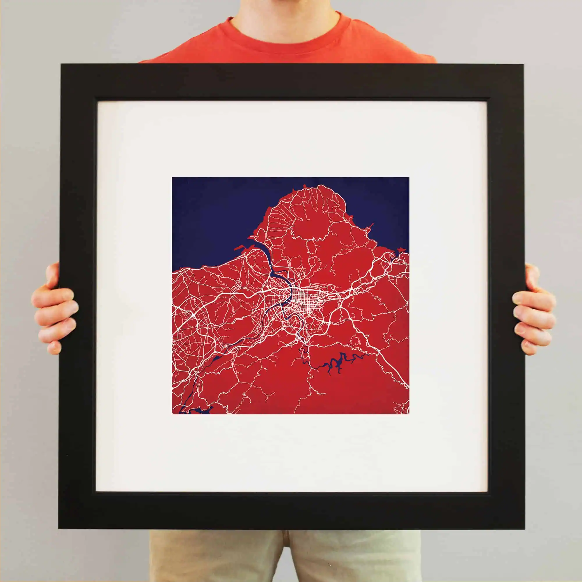 Vivid map of a city highlighting road networks, rivers, and urban layout printed as artwork, showcasing detailed cartographic design.