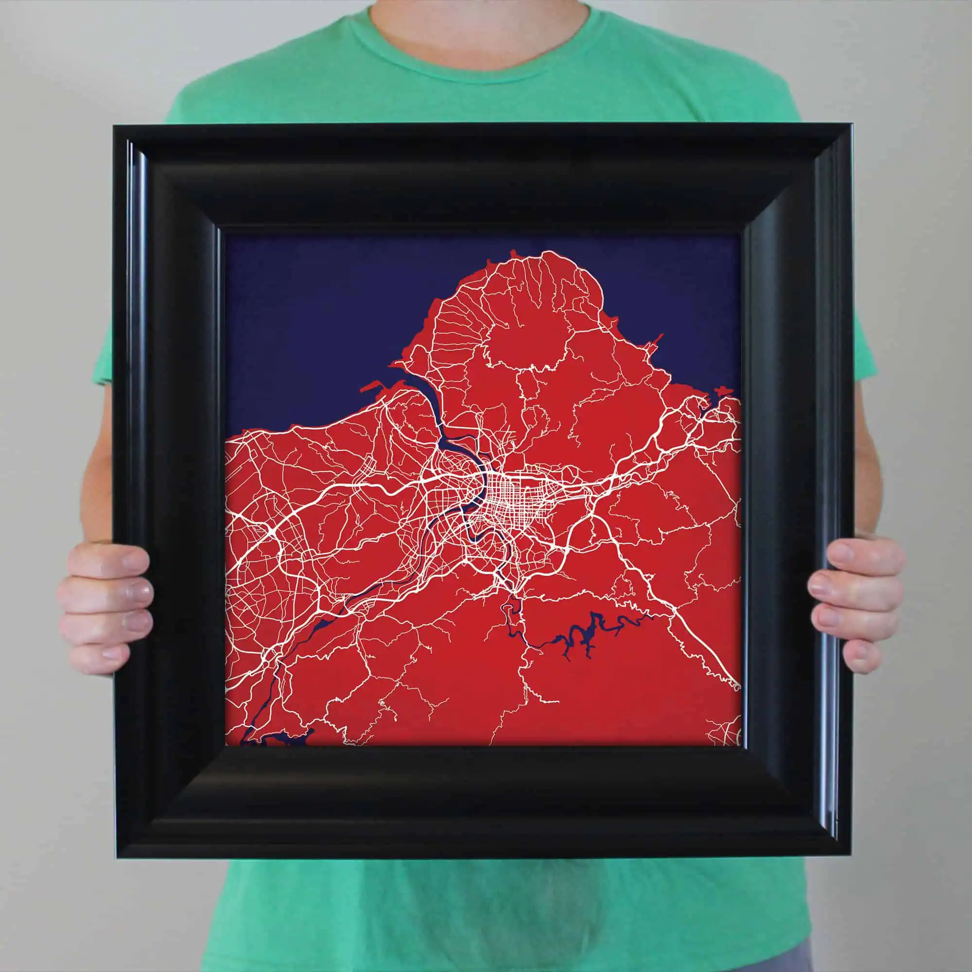 Detailed map of a city with road networks and waterways, stylized in red, white, and dark blue, perfect for urban navigation and geographic reference.