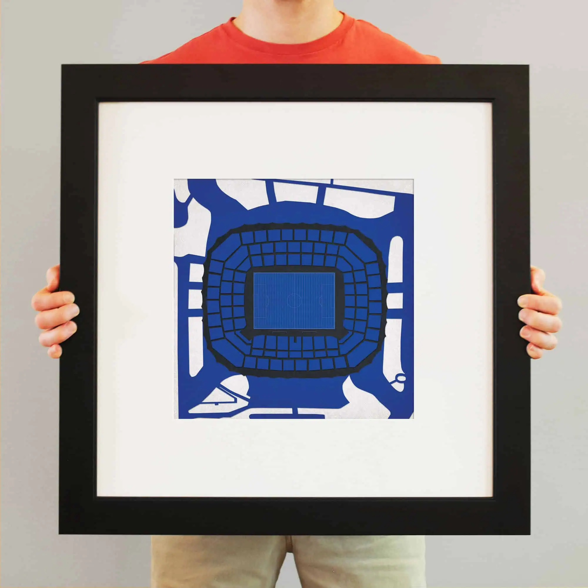 Aerial view of a stadium captured in a blue color palette, emphasizing the seating arrangement and central field, ideal for sports, event planning, or architectural map purposes.