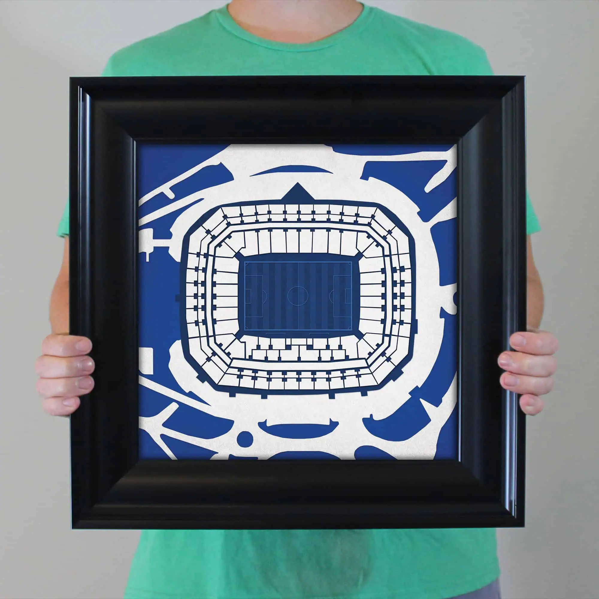 A framed map illustration of a sports stadium with detailed seating and field layout, showcasing a vibrant blue and white color scheme, perfect for sports fans and stadium enthusiasts.