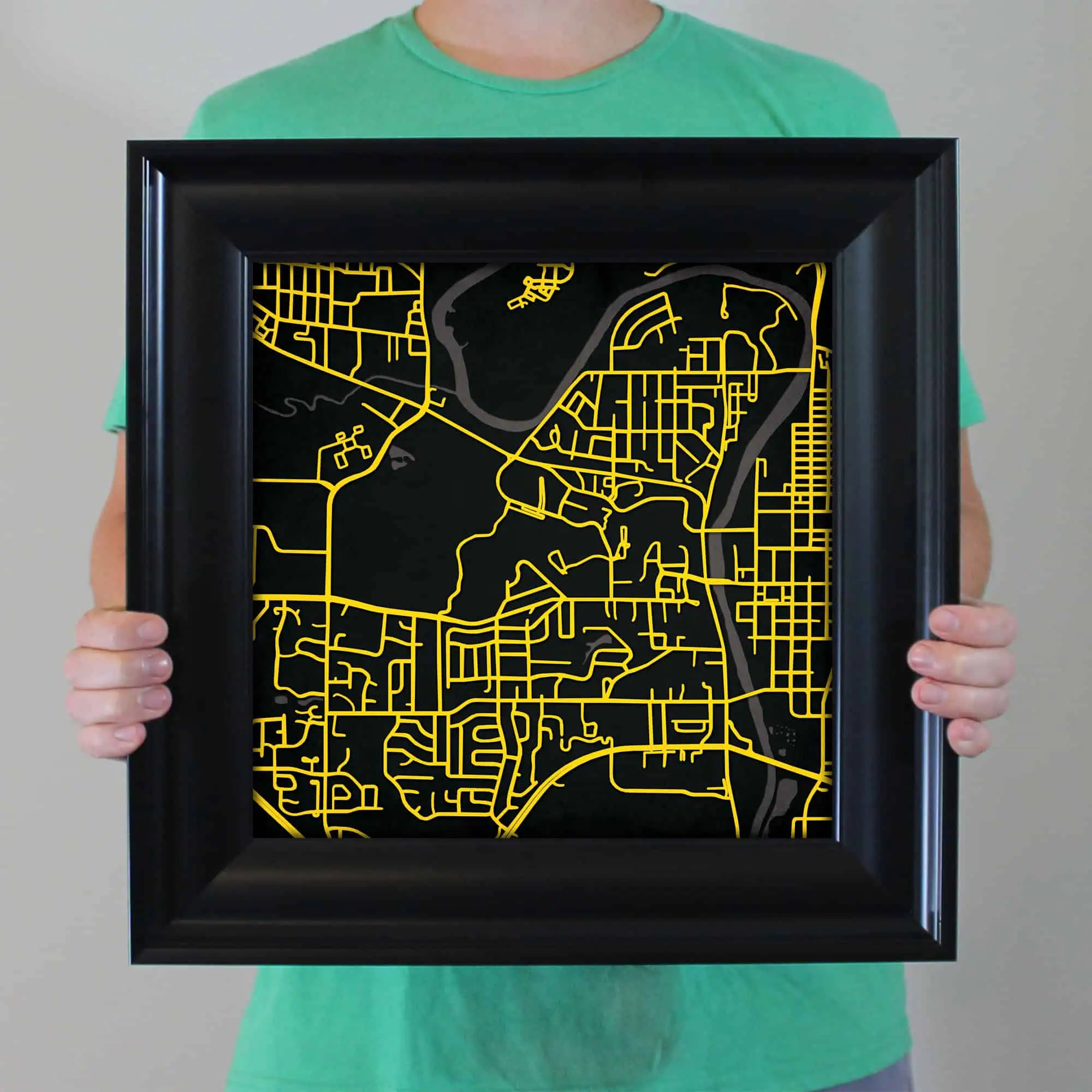 Colorful map art print with yellow street lines on black background, framed for wall decoration, ideal for home or office map enthusiasts, showcasing detailed urban planning and design.