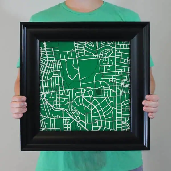 Map of urban streets in a black frame, representing detailed city maps and navigation tools.