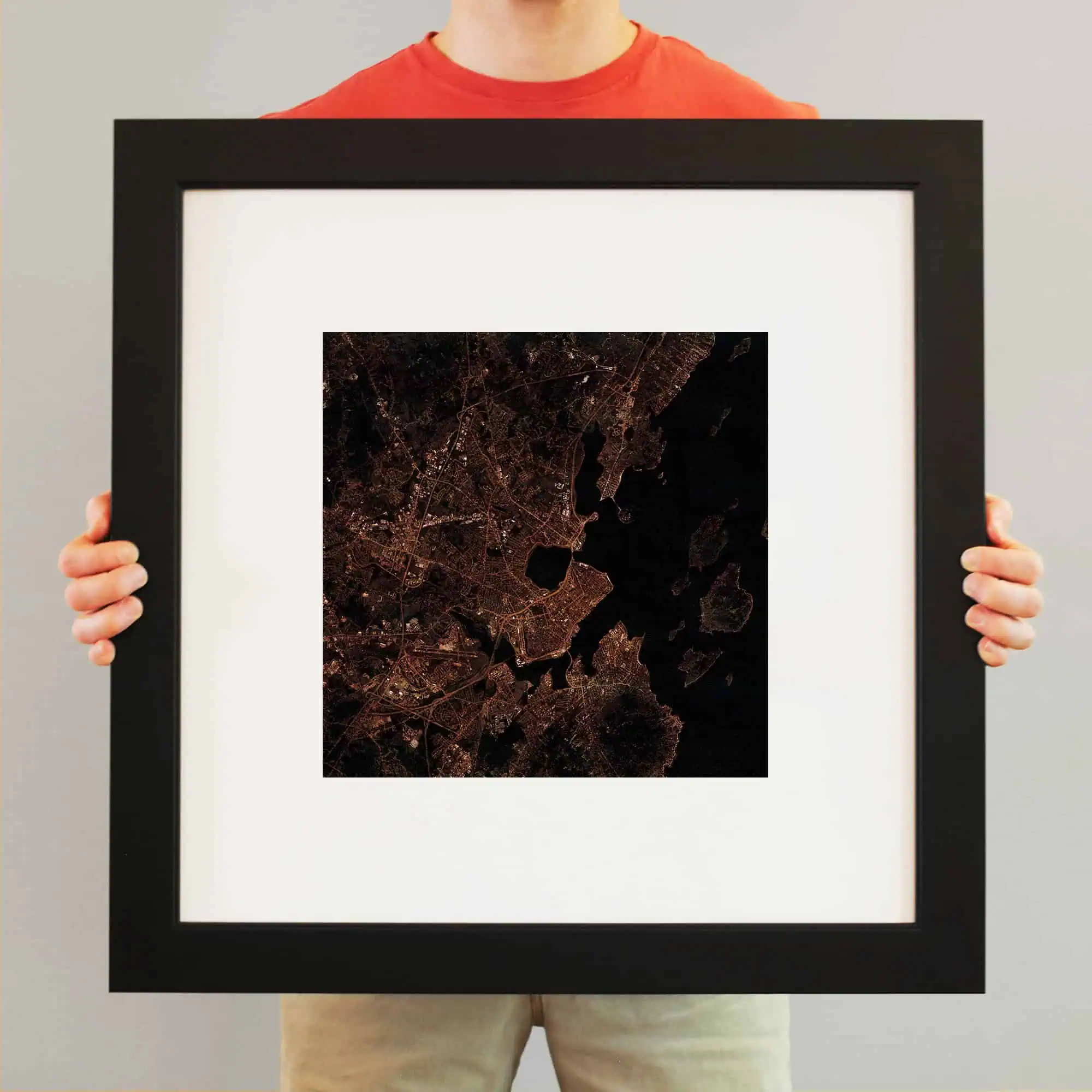 Aerial night map of a city with illuminated roads and dark water bodies, showcasing detailed urban planning and city layout, perfect for travel and navigation enthusiasts.