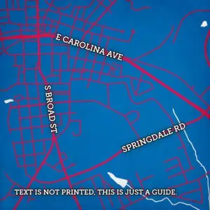 A detailed city street map highlighting roads such as E Carolina Ave, S Broad St, and Springdale Rd, with vibrant red street lines on a blue background, serving as a navigation and travel planning tool.