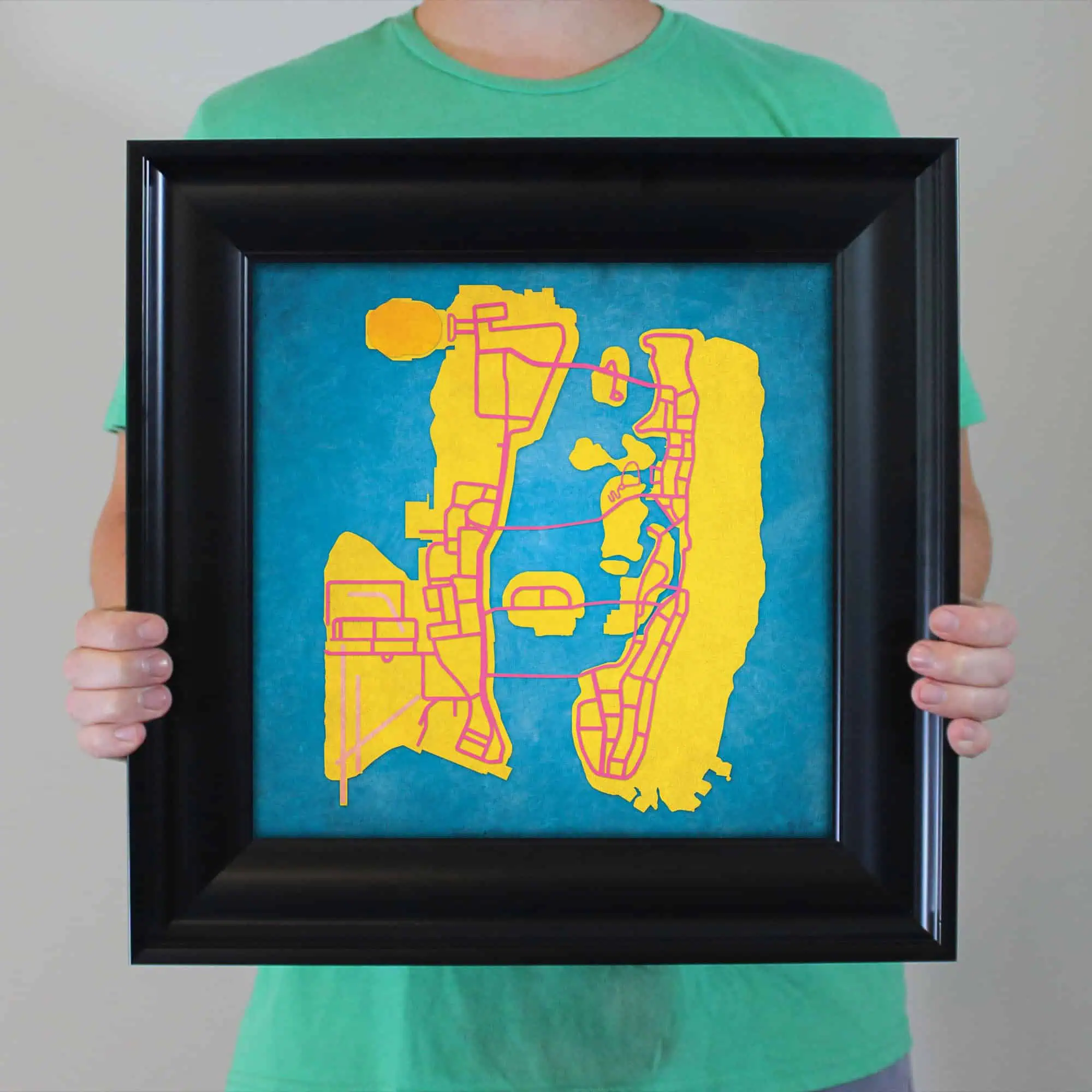 Colorful city map artwork featuring streets and landmarks, showcased in a black frame for home, office, or travel decor. Perfect for map enthusiasts and travel lovers.