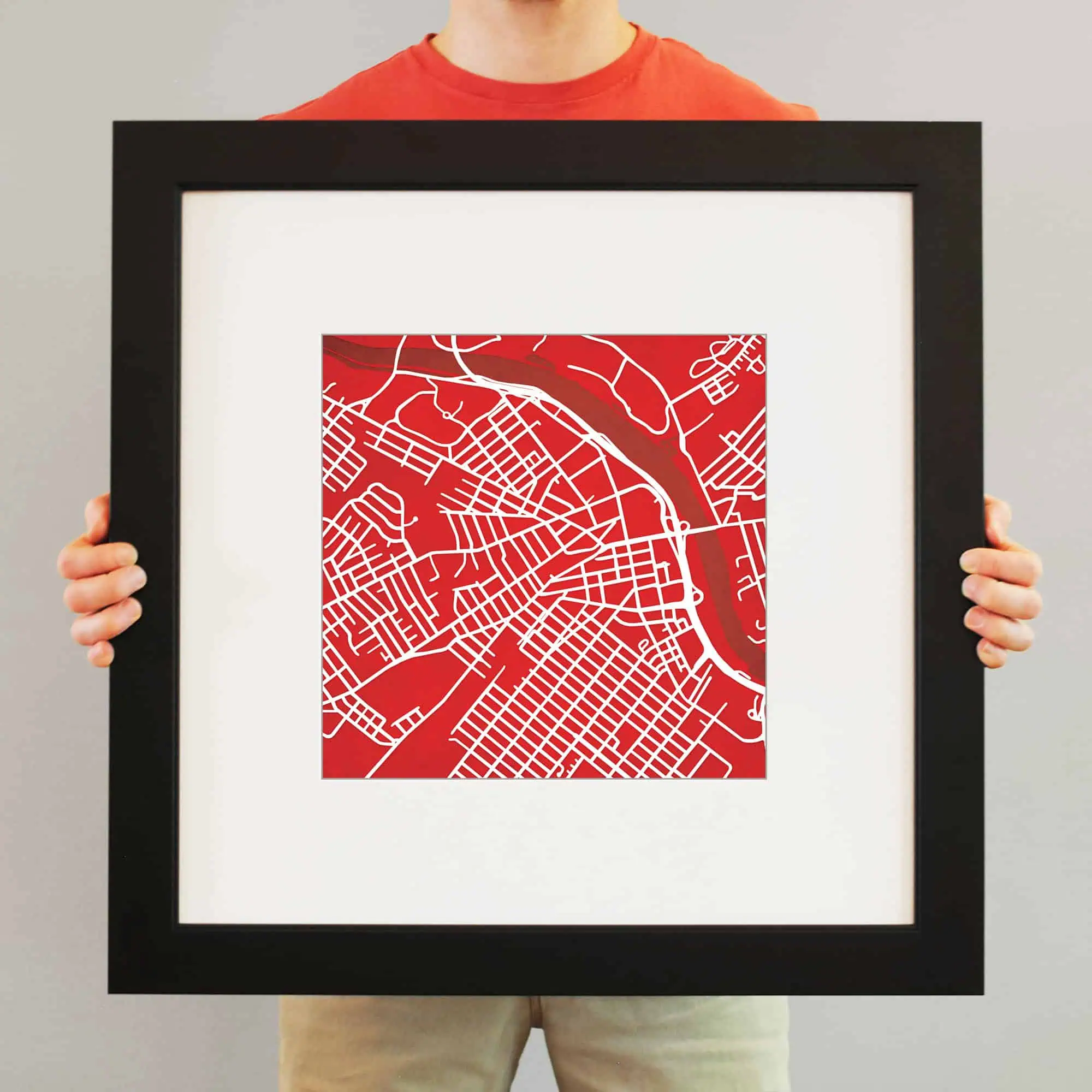 Vibrant red city map art print framed, showcasing detailed street layout and waterways, perfect for urban decor and map enthusiasts.