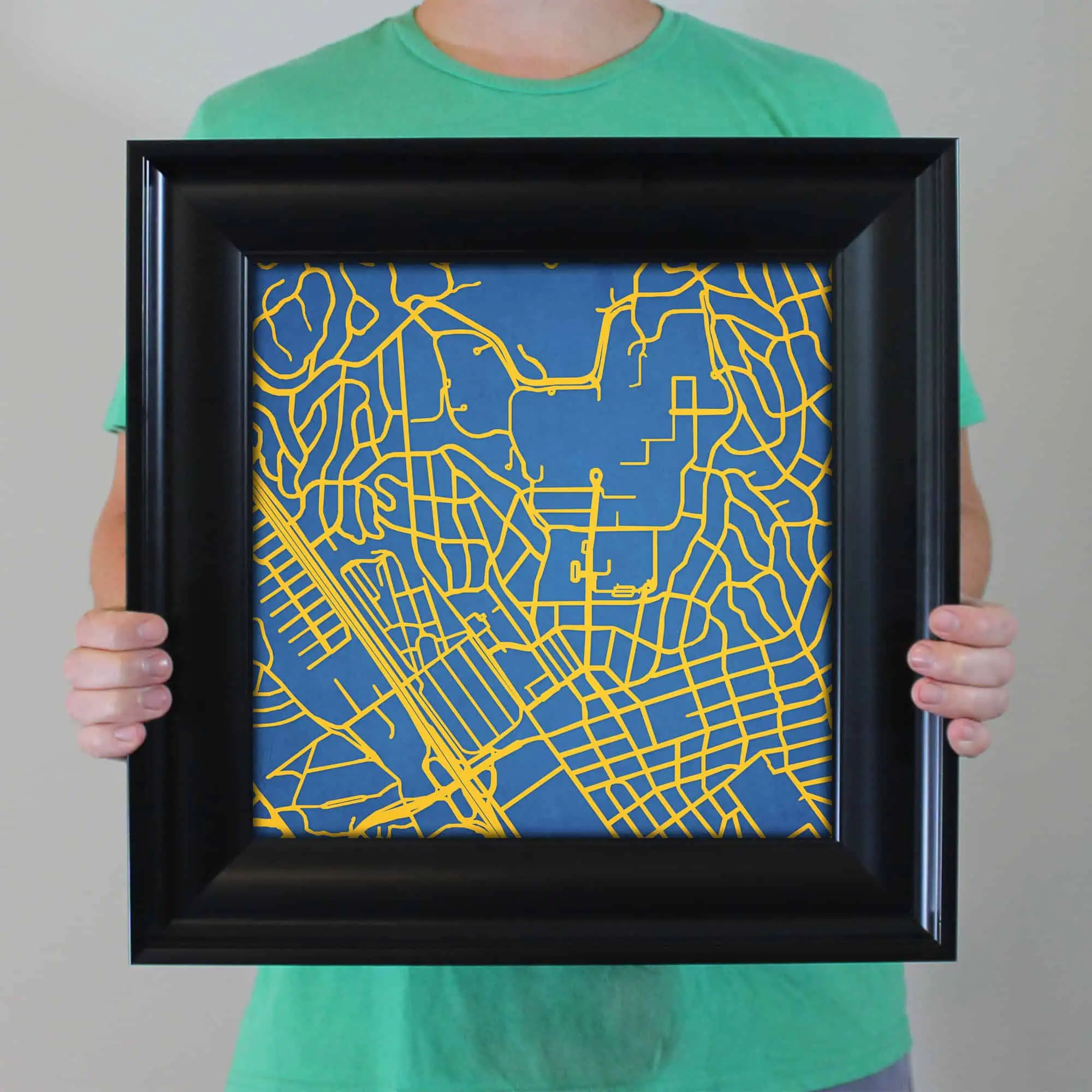 Colorful city street map art print featuring vibrant yellow street lines on a deep blue background, perfect for home decor or travel enthusiasts.