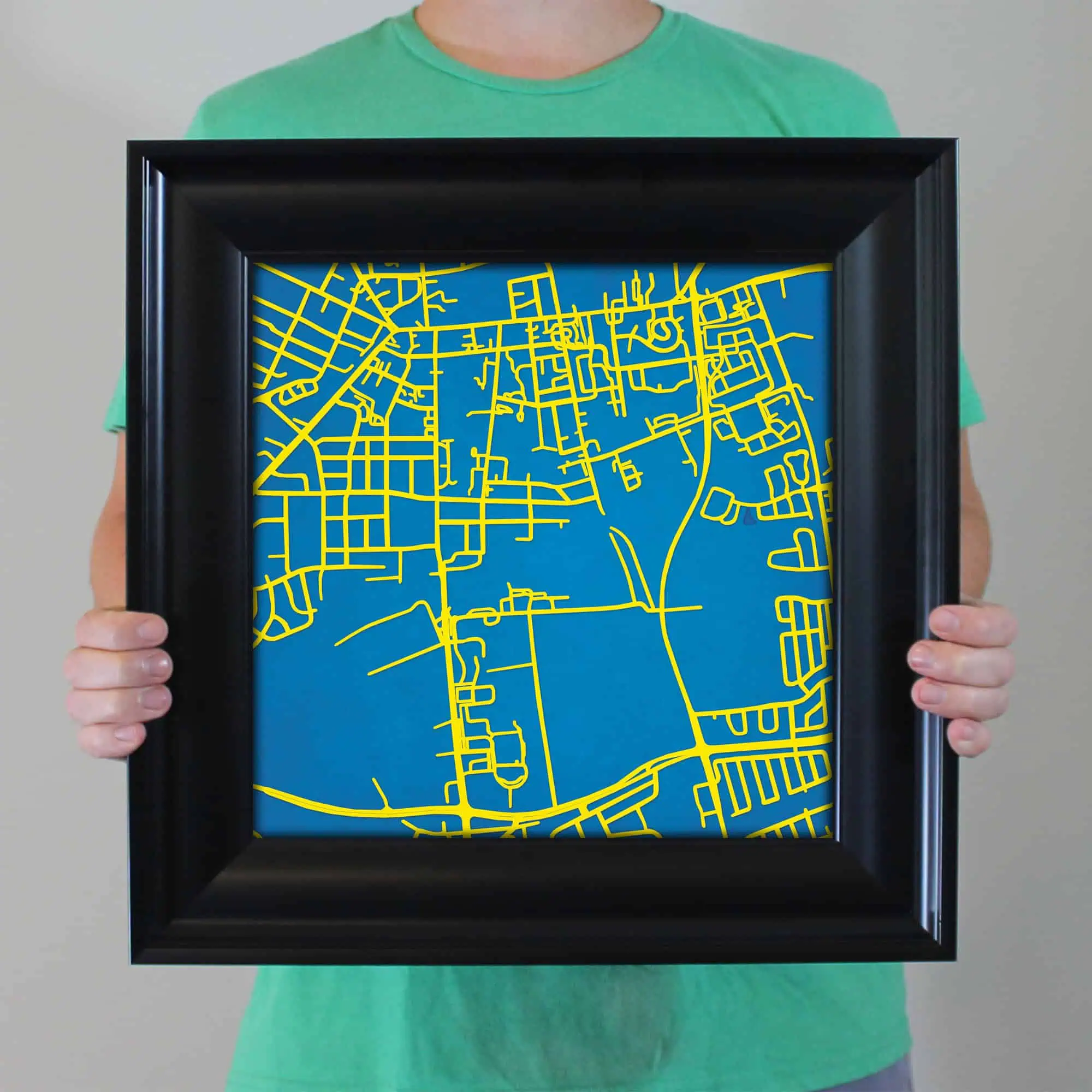 Detailed city street map with vibrant yellow roads on a blue background, perfect for travel planning or geographic reference.