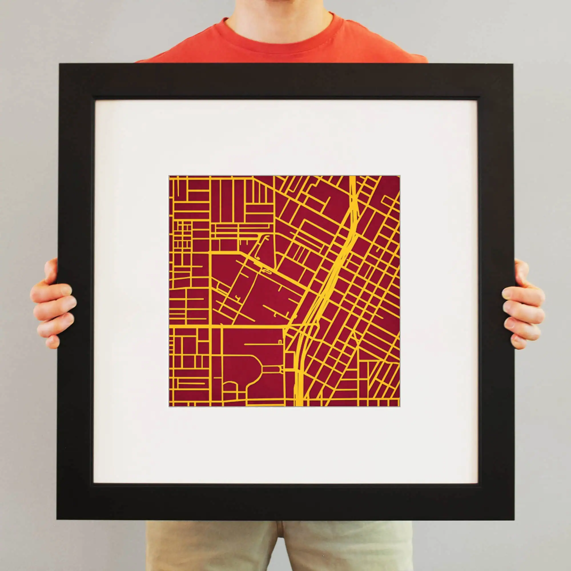 Vibrant city map artwork with red background and yellow street lines, perfect for home or office decor, highlighting detailed urban layouts and geographic artistry.