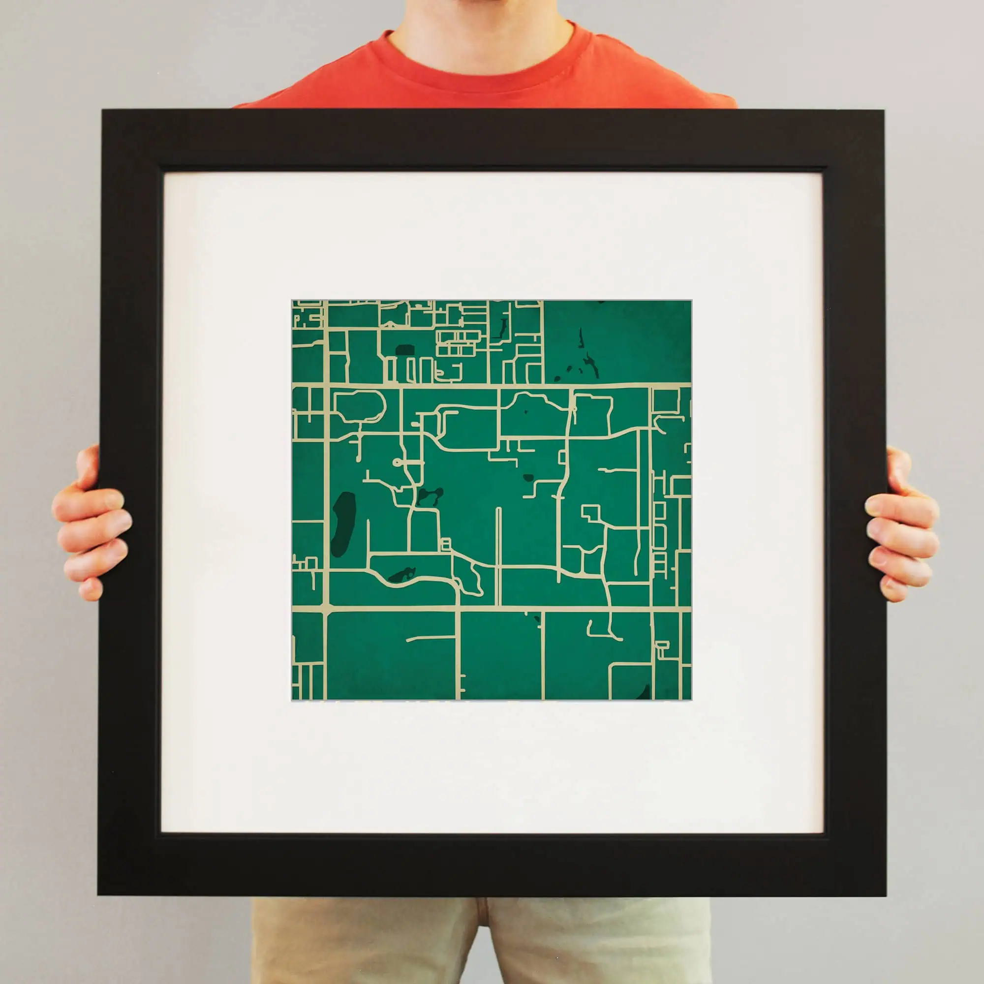 Colorful illustrated map of a city street grid, framed artwork for map enthusiasts and travelers, perfect for home or office decor, showcasing detailed mapping and cartography.