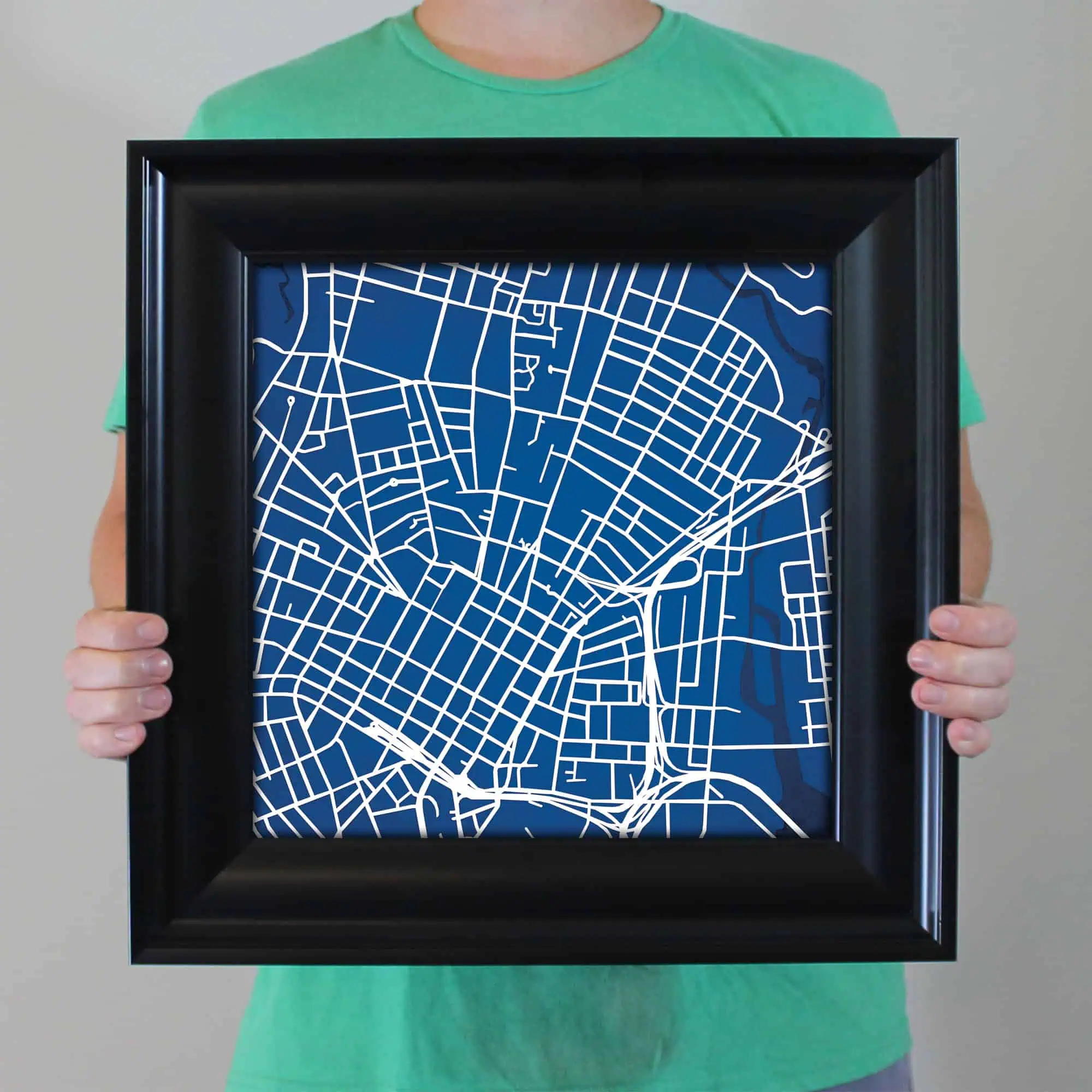 Detailed city map artwork in a black frame, perfect for home or office decor, showcasing map and navigation themes, ideal for map enthusiasts and travelers.