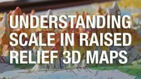 3. A close-up of a folded paper map with colorful topographic details used for understanding scale in raised relief 3D maps, emphasizing navigation and geographic visualization tools.